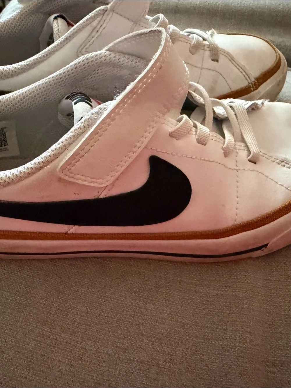 Nike White Sneakers with Black Swoosh and Tan Stripe
